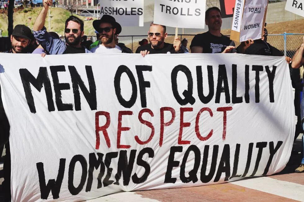 men with poster "men of quality respect womens equality"