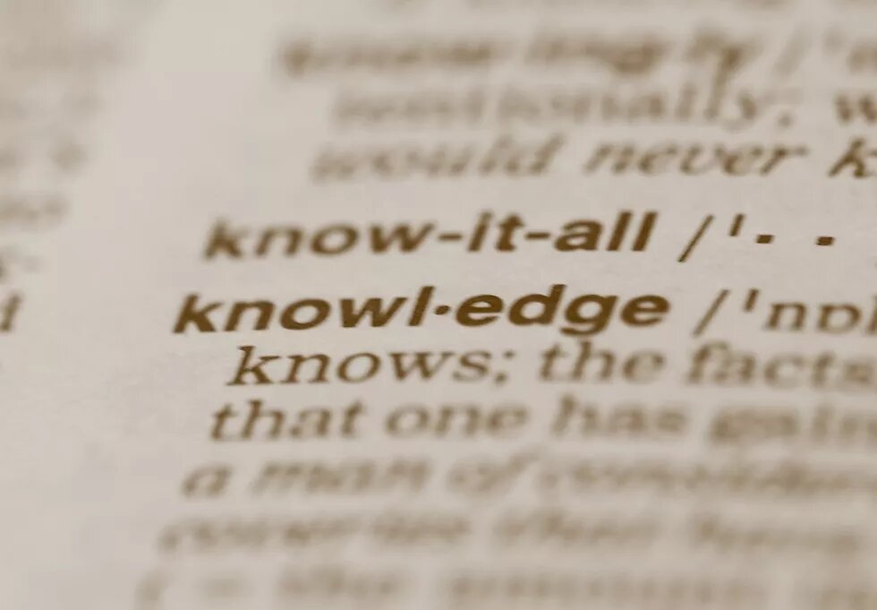 camera focus on the word "knowledge" in a dictionary