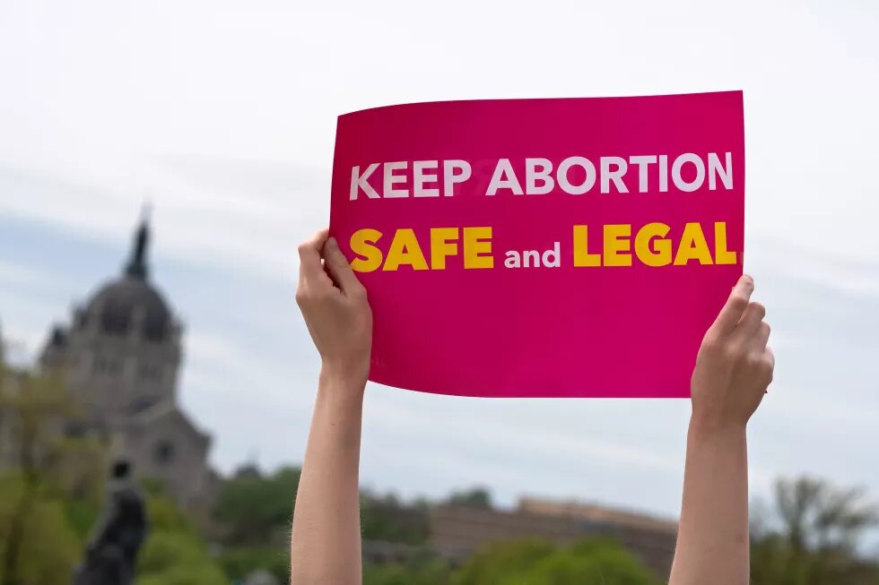 Keep Abortion Safe And Legal sign at a Stop Abortion Bans Rally