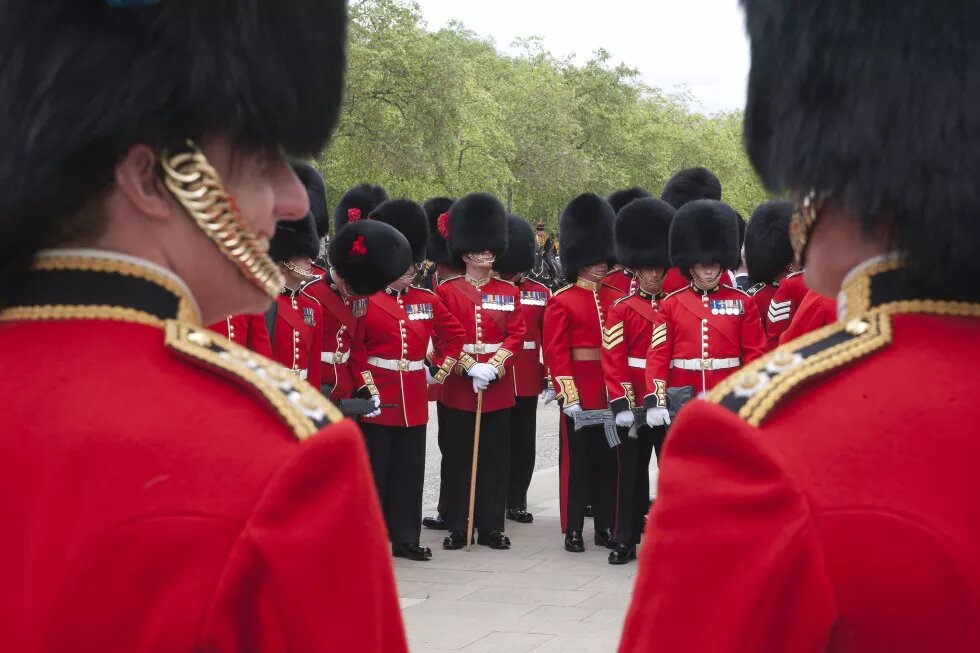 Members of the British Coldstream Guards display a very different kind of military masculinity when parading in front of Buckingham Palace in bearskin hats compared to when on patrol in Afghanistan