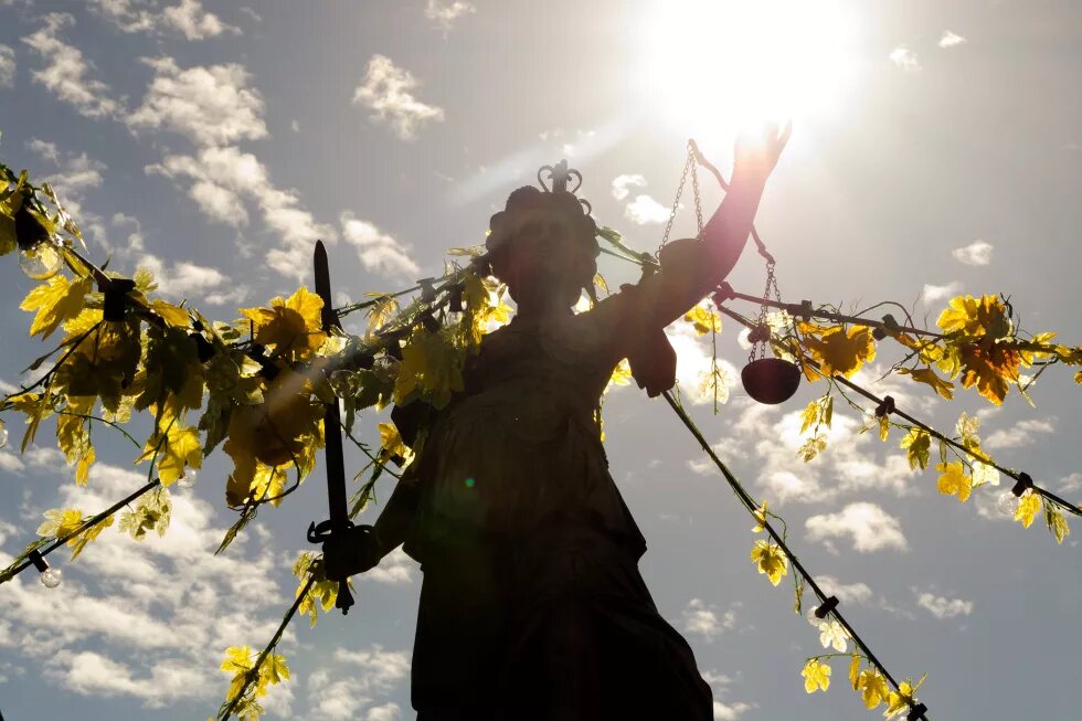 Justitia in the sunlight with grape leaves