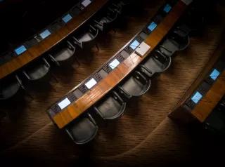 empty seats/chairs in parliament from above